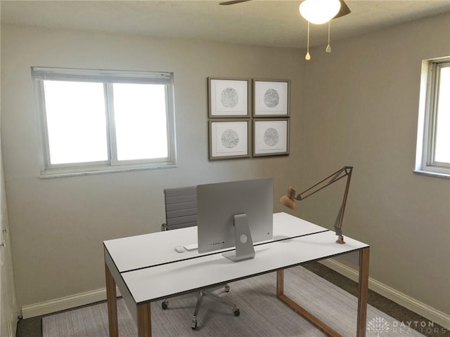 office area featuring ceiling fan and baseboards