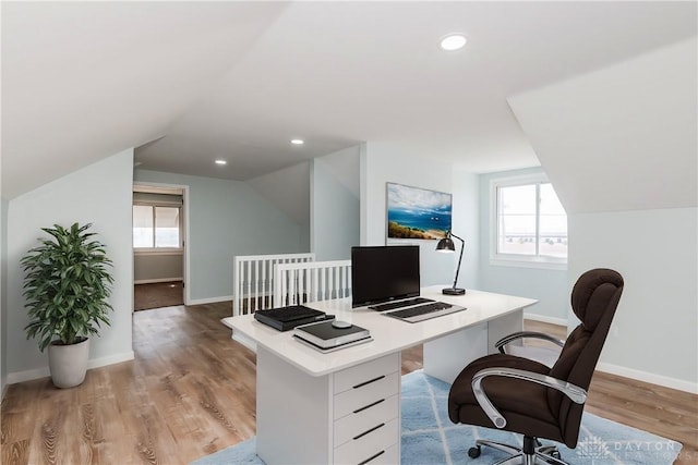 office featuring light wood-style flooring, baseboards, a wealth of natural light, and recessed lighting