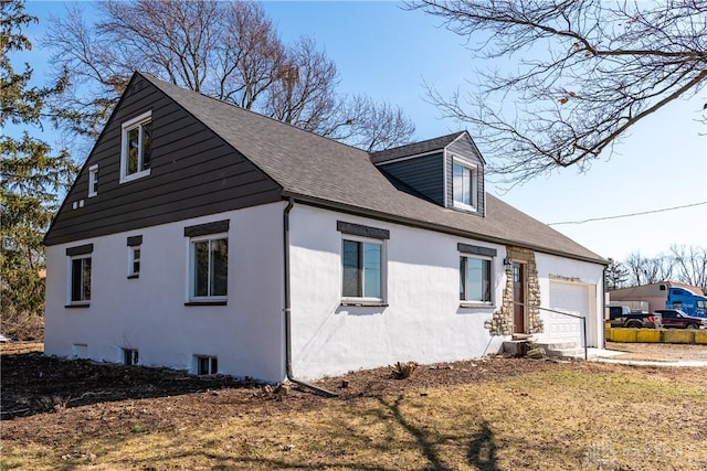 view of home's exterior with driveway, an attached garage, and stucco siding