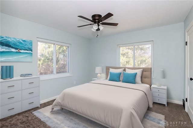 bedroom with light carpet, ceiling fan, and baseboards