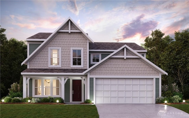 view of front of property with concrete driveway, a front lawn, and an attached garage