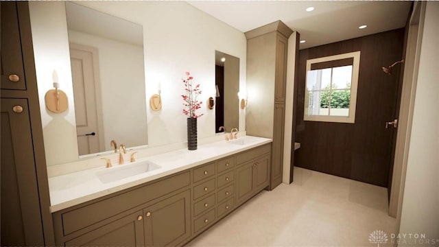 bathroom with double vanity, a sink, and recessed lighting