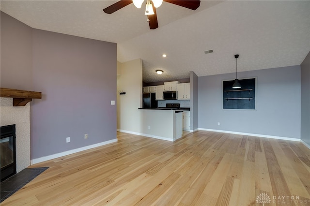 unfurnished living room featuring a fireplace with flush hearth, visible vents, light wood-style floors, and baseboards