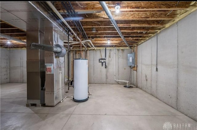 unfinished below grade area with gas water heater, heating unit, and electric panel