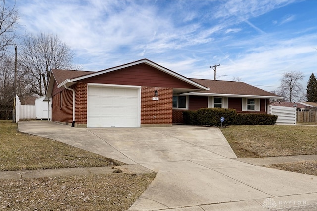 ranch-style house featuring a garage, driveway, brick siding, and fence