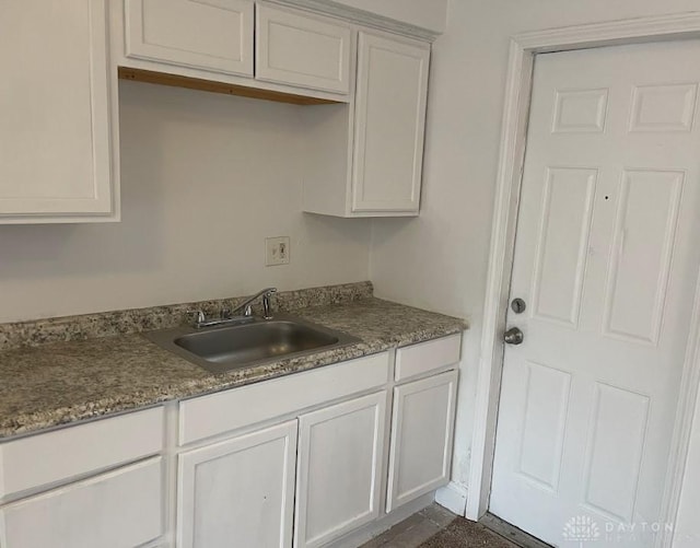 kitchen with white cabinets and a sink