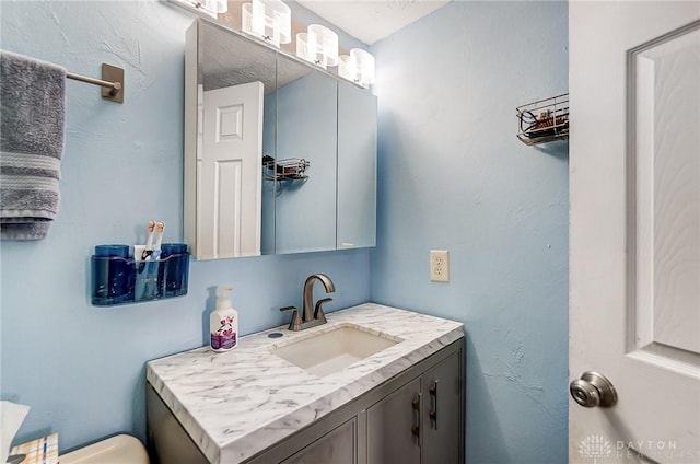 half bath with vanity and toilet