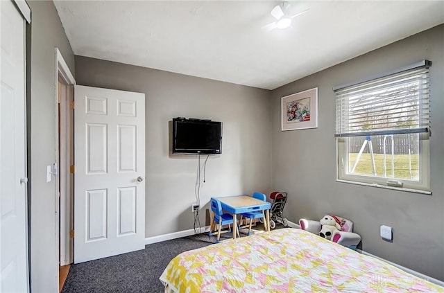 bedroom with carpet and baseboards