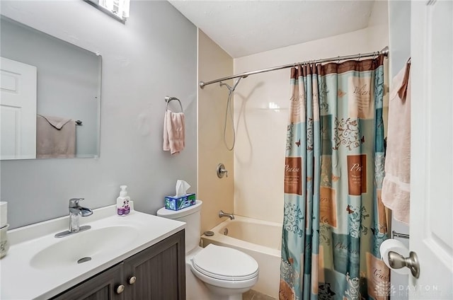 bathroom with shower / tub combo, vanity, and toilet