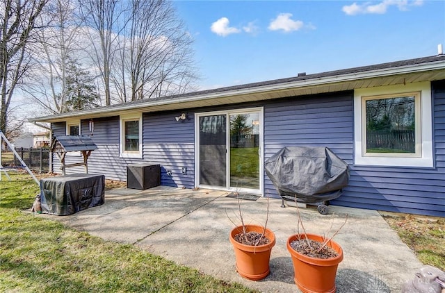 back of house featuring a patio area and fence