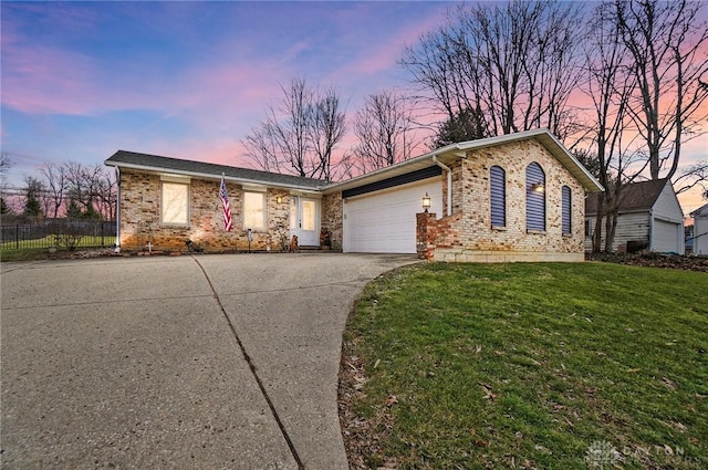 single story home featuring driveway, a garage, a lawn, fence, and brick siding