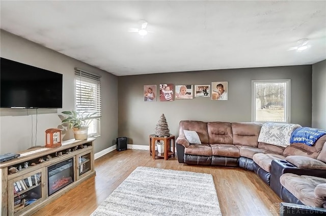 living area featuring wood finished floors and baseboards