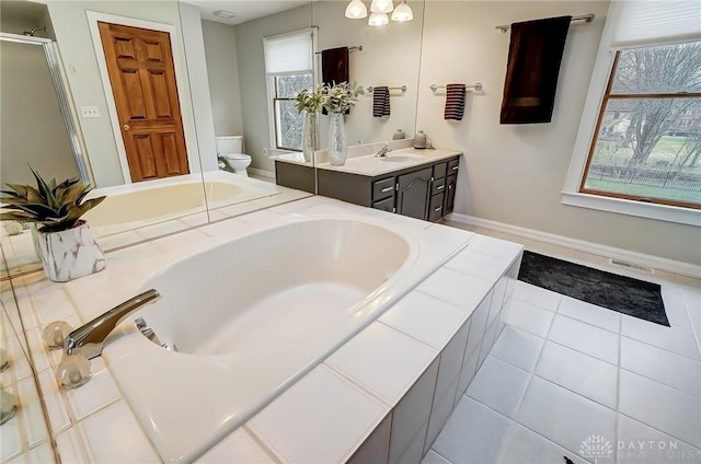 full bath featuring toilet, plenty of natural light, visible vents, and a bath