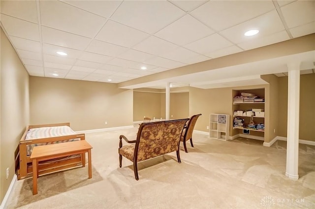 living area featuring recessed lighting, baseboards, and light colored carpet