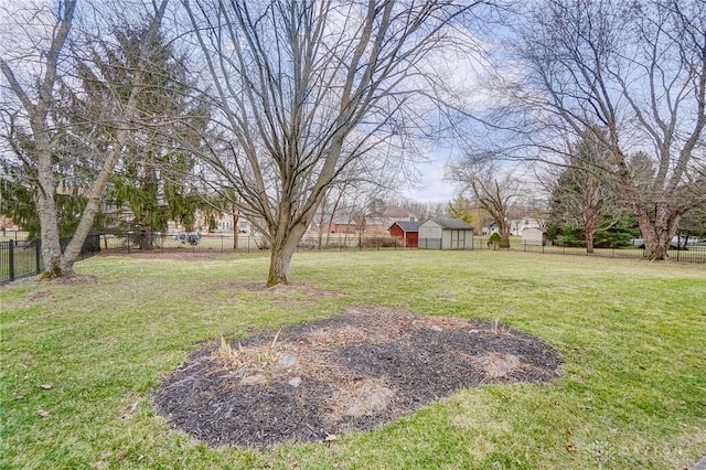 view of yard featuring a fenced backyard and an outdoor structure