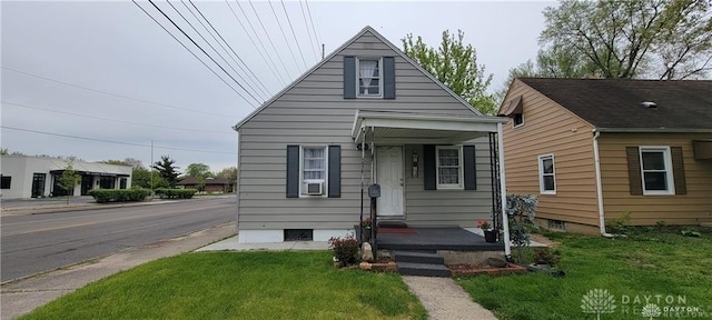 bungalow featuring a front yard