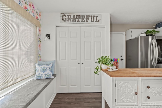 mudroom with dark wood-style flooring