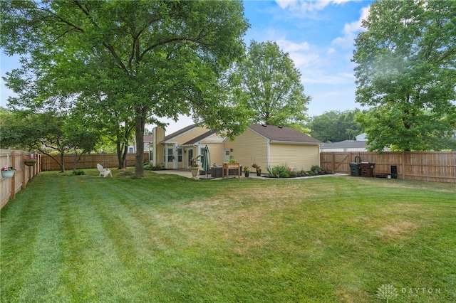 view of yard featuring a patio and a fenced backyard