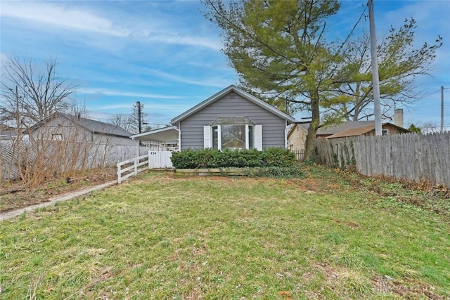 exterior space featuring fence and a yard