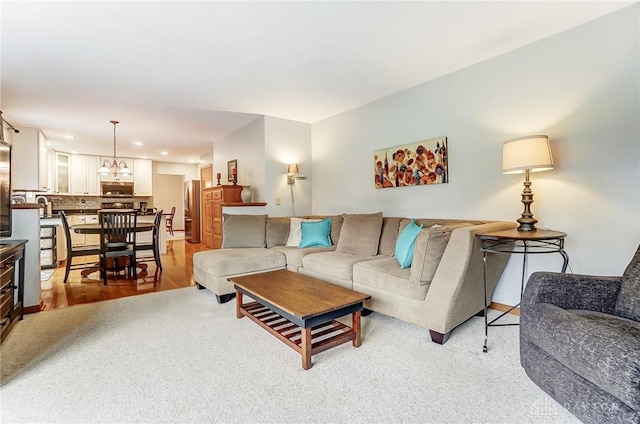 living room featuring light wood-style floors and recessed lighting