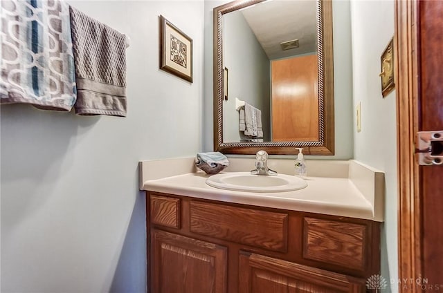 bathroom featuring visible vents and vanity