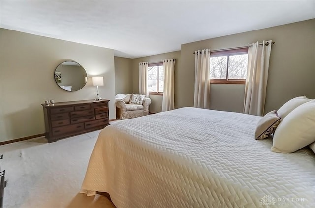 carpeted bedroom with baseboards