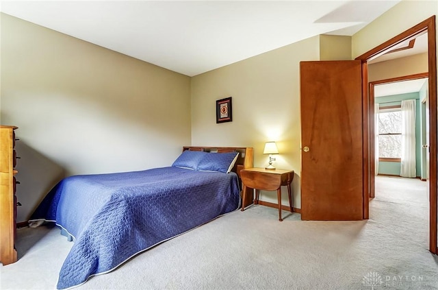 carpeted bedroom with baseboards