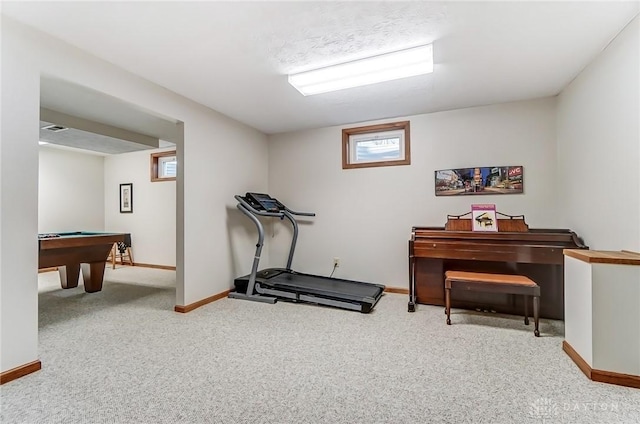 exercise room featuring visible vents, baseboards, and carpet flooring