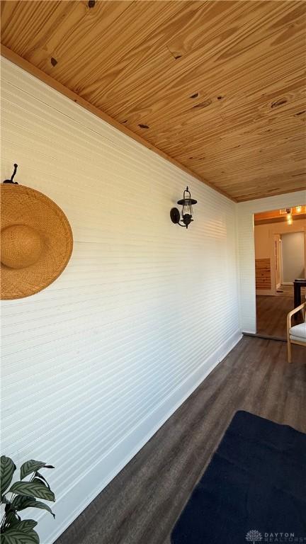 interior space with wood ceiling and dark wood-style flooring