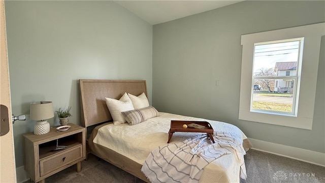 carpeted bedroom featuring baseboards