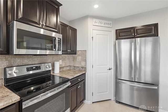 kitchen with dark brown cabinets, stainless steel appliances, backsplash, and recessed lighting