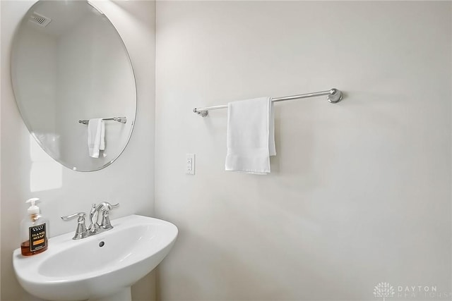 bathroom featuring a sink and visible vents