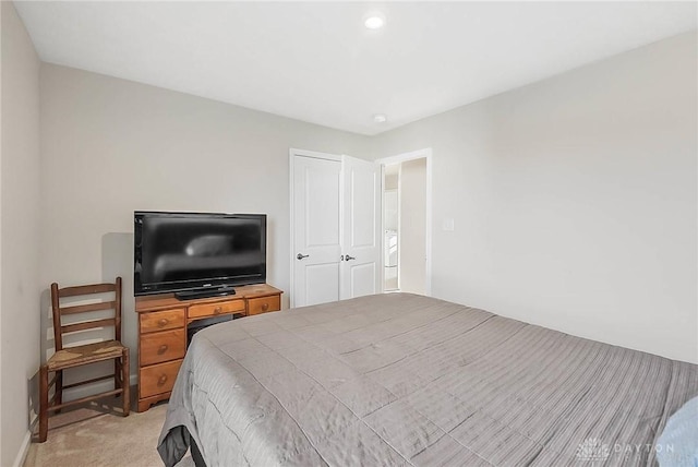 bedroom with light colored carpet