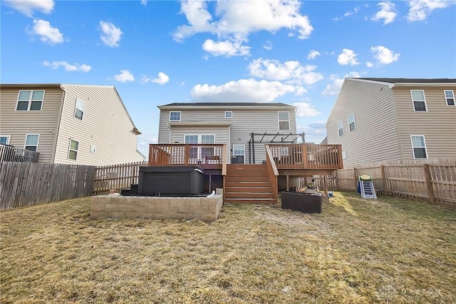 back of property featuring a yard, a fenced backyard, and a wooden deck