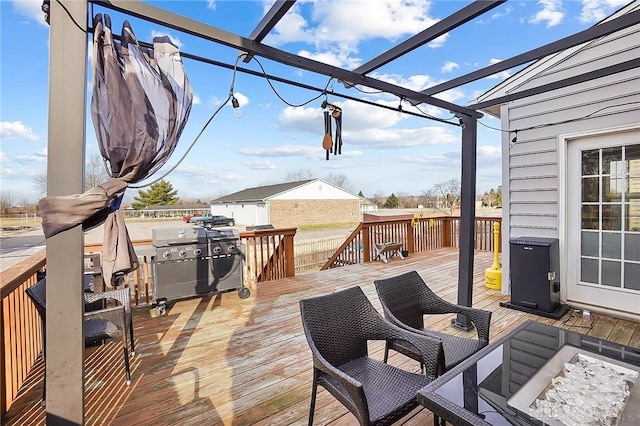 wooden deck featuring area for grilling