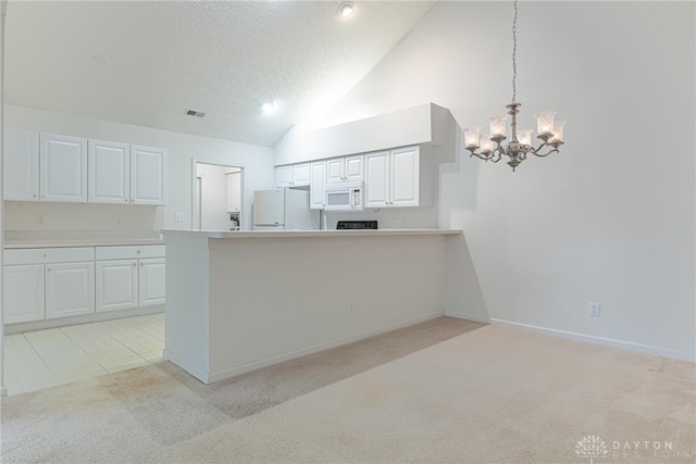 kitchen featuring light carpet, white appliances, visible vents, light countertops, and white cabinetry