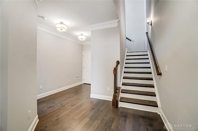 121 Lowe Ln, Dayton, OH 45402 - stairway with baseboards, visible vents, ornamental molding, and wood finished floors