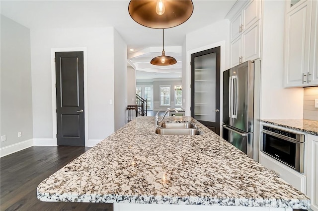 121 Lowe Ln, Dayton, OH 45402 - kitchen with dark wood-style flooring, a sink, white cabinetry, appliances with stainless steel finishes, and a center island with sink