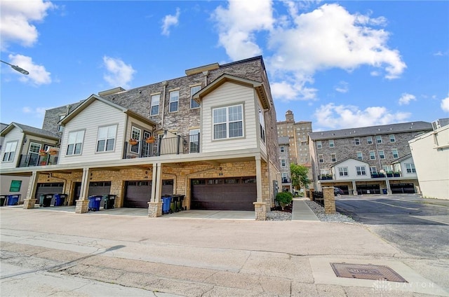 121 Lowe Ln, Dayton, OH 45402 - view of front of house with a garage and stone siding