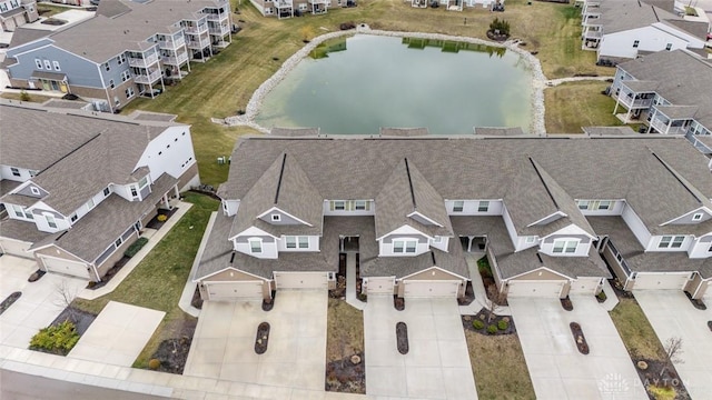 aerial view with a water view and a residential view