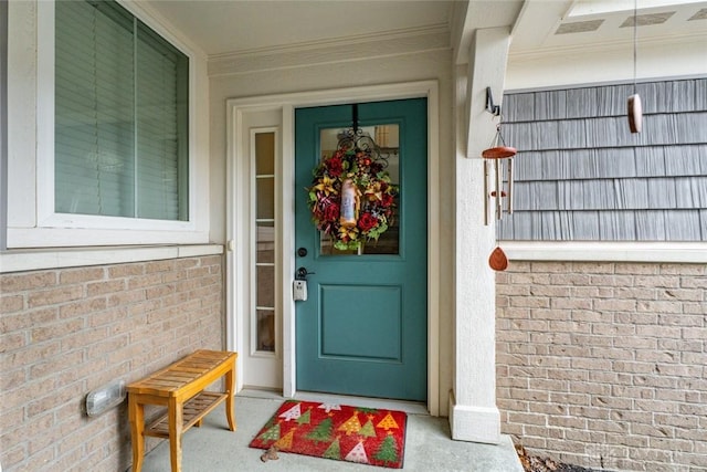 entrance to property with brick siding