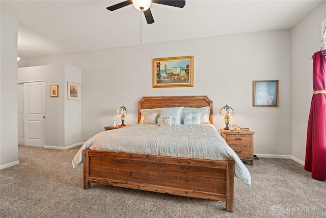 carpeted bedroom with a ceiling fan and baseboards