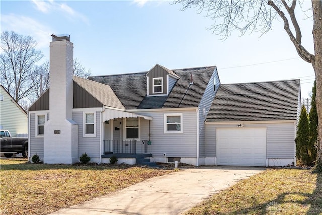 cape cod home with a shingled roof, covered porch, a garage, driveway, and a front lawn