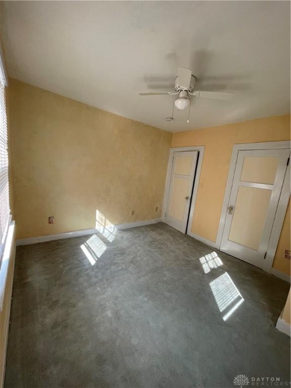 50 Woodcrest Ave, Dayton, OH 45405 - unfurnished bedroom featuring baseboards and ceiling fan