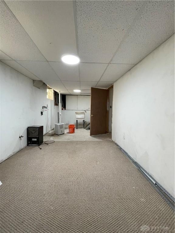50 Woodcrest Ave, Dayton, OH 45405 - finished below grade area with a sink, a paneled ceiling, and light colored carpet
