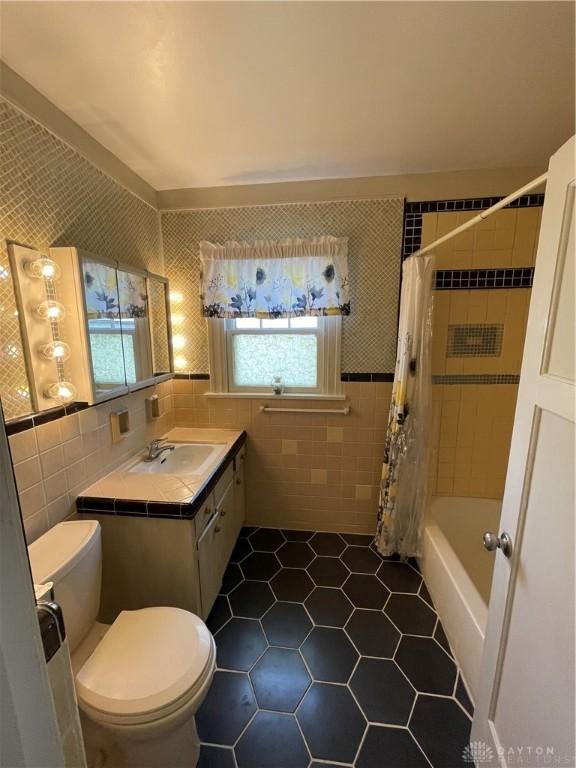 50 Woodcrest Ave, Dayton, OH 45405 - full bath with tile walls, toilet, tile patterned flooring, and vanity