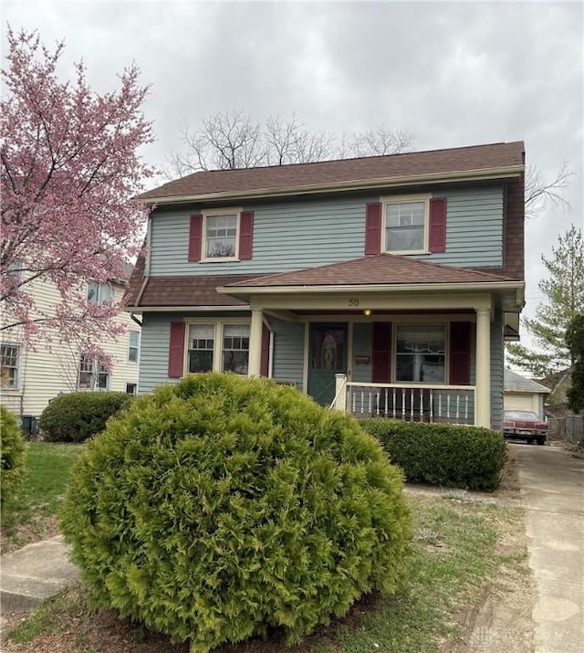 50 Woodcrest Ave, Dayton, OH 45405 - view of front facade with a porch and a garage