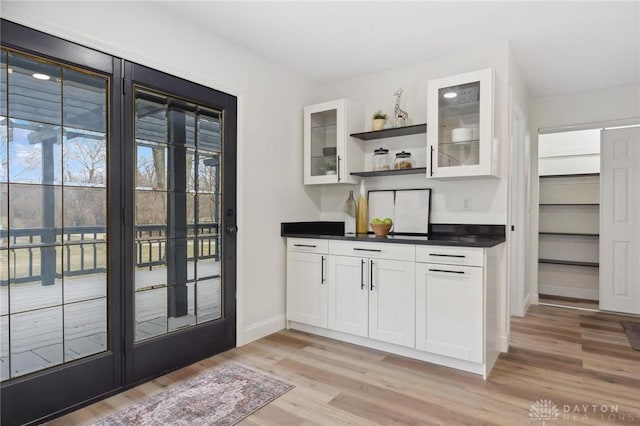 interior space with light wood-style flooring and baseboards