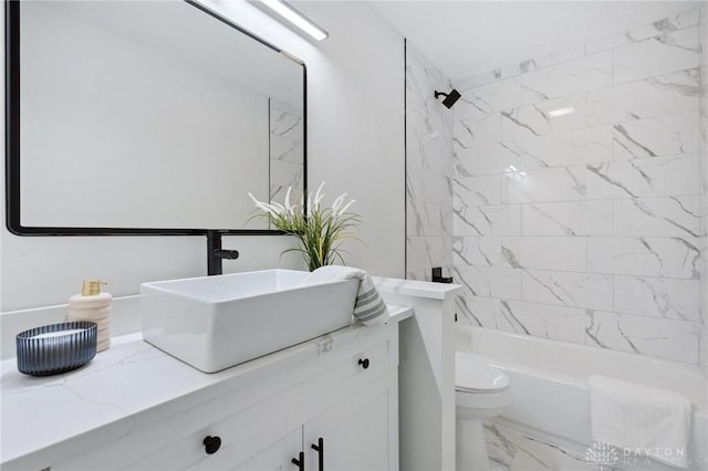 full bath featuring toilet, marble finish floor,  shower combination, and vanity