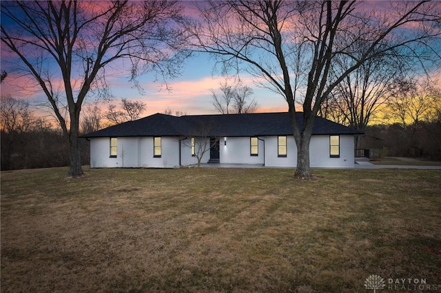 view of front of house with a yard